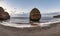 Stunning sunrise landscape image of Ladram Bay beach in Devon England with beautiful rock stacks on beach