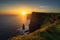 stunning sunrise over a towering cliff, with the sun rising in the distance