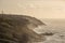 Stunning sunset landscape image of Cornwall cliff coastline with tin mines in background viewed from Pendeen Lighthouse headland