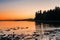 Stunning Sunset over a Bay with Mountains on the Horizon