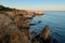 Stunning sunset view of the secluded beach and colorful cliffs. Algarve region, Portugal