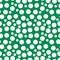 Stunning, trendy seamless pattern of white balls in a simple flat style on a green background. For children s clothing