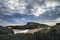 Stunning Twr Mawr lighthouse landscape from beach with dramatic