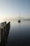 Stunning unplugged fine art landscape image of sailing yacht sitting still in calm lake water in Lake District during peaceful