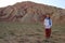 Stunning unusual colored mountains in Iran near Tabriz. Turis man on a background of mountains. Natural attractions of Iran.