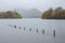 Stunning vibrant long exposure landscape image of Derwentwater looking towards Catbells peak in Autumn during early morning