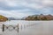 Stunning vibrant long exposure landscape image of Derwentwater looking towards Catbells peak in Autumn during early morning