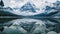 A stunning Video of a majestic mountain range mirrored in the calm and still water of a lake, Icy mountain peaks reflected in a