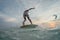 Stunning view of an African-American surfer catches a wave