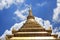 Stunning view of a Buddhist temple spire, dramatically soaring up into the sky