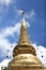 Stunning view of a Buddhist temple spire, dramatically soaring up into the sky