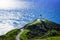 Stunning view at Cape Reinga Lighthouse and a winding path leading to it. Famous tourist attraction at Cape Reinga, Far