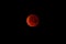 Stunning view  of a deep orange lunar eclipse