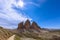 Stunning view of famous three peak of Tre Cime di Lavaredo on the rays of the midday sun.