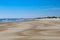 Stunning view of an idyllic beach featuring white sand, rolling sand dunes