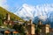 Stunning View of Medieval Svan Tower-houses against the Snow-capped Caucasus Mountain in Mestia, Georgia