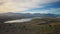 A stunning view of milky-turquoise blue Lake Tekapo from the summit of Mount John in New Zealand during autumn.