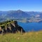Stunning view from Mount Niederhorn. Azure blue Lake Thun and Mo