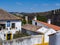 Stunning view of Obidos, with the typical white houses and the internal battlements of the medieval walls, Oeste region, Portugal