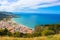 Stunning view over the bay on Tyrrhenian coast by city Cefalu, Sicily, Italy. On the adjacent rocks overlooking blue sea