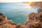 Stunning view over Praia do Camilo in Lagos, Algarve Portugal during the sunrise. Rocks, cliffs and formations in the ocean.
