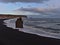 Stunning view over volcanic landscape with black beach Reynisfjara on the coast of Iceland with rock formations Arnardrangur.