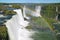 Stunning view of Powerful Iguazu Falls UNESCO World Heritage Site from Brazilian side with a gorgeous rainbow, Foz do Iguacu