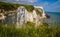 Stunning view of a rocky cliff edge along a grassy shoreline in White Cliffs of Dover, England