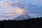 Stunning view of the smoky Popocatepetl stratovolcano top in Mexico under a cloudy sky