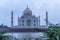 Stunning view of the Taj Mahal in Agra, India, with the River Yamuna visible in the foreground.