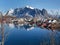 Stunning viewpoint at Reine fishing village, Lofoten Islands, Norway, landscape and seascape of clear water reflection, mountain