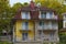 Stunning vintage yellow three-storied house under ancient tile with front garden. Beautiful place for summer vocation.