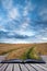 Stunning wheat field landscape under Summer stormy sunset sky co