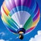 A stunning white hotr balloon with rainbow colors floating on a blue