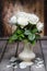 Stunning white roses in ceramic vase.