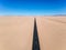 Stunning wide angle aerial drone view of the B4 desert road and a train line between LÃ¼deritz and Keetmanshoop