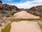 Stunning wide angle aerial drone view of the dry riverbed and an old dam with rests of water near Ai-Ais Hot Springs