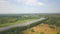 Stunning wide river and autumn forest on a sunny day. Clip. Aerial view of countryside natural background with fields