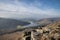 Stunning Winter landscape image of the Peak District in England viewed from Bamford Edge with Ladybower Reservoir under a