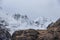 Stunning Winter landscape image of snowcapped Three Sisters mountain range in Glencoe Scottish Highands with dramatic sky