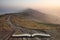 Stunning Winter sunrise landscape image of The Great Ridge in the Peak District in pages of open book, story telling concept