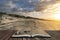 Stunning Winter sunrise over West Wittering beach in Sussex England with wind blowing sand across the beach in pages of open book