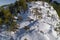 Stunning winter wonderland landscape featuring a snow-covered mountain range with two deers running