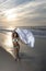 Stunning young African-American woman on beach at sunrise