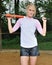 Stunning young blonde female softball player