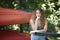 Stunning young brunette woman standing with bright canoes