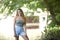 Stunning young brunette woman standing in shallow creek