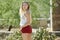 Stunning young Latina woman poses in red shorts - desert