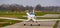 Stunt airplane landing on the air strip in closeup, recreational sport and hobby, air transportation background