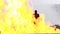 Stunt girl in a fiery explosion.